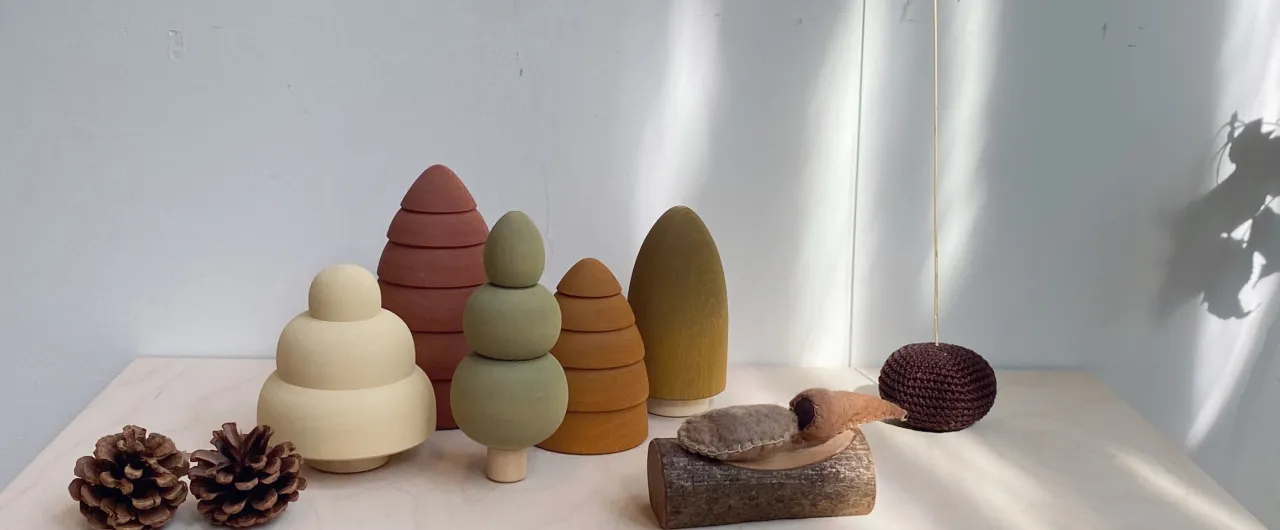 Wooden toys with soft rounded edges and warm earthy colors