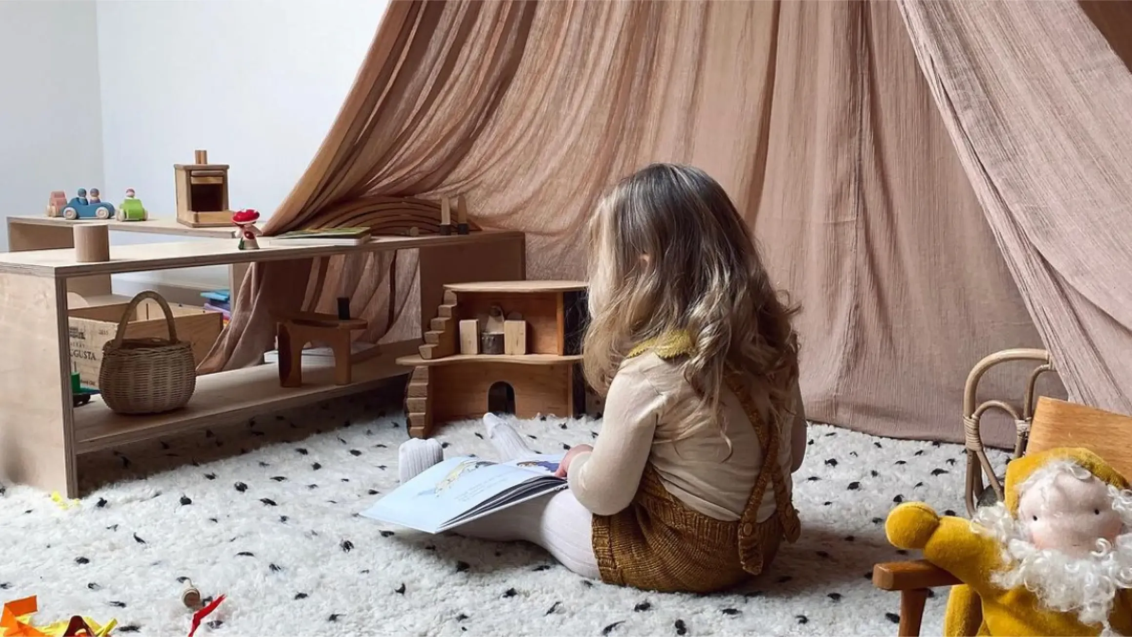 Girl reading, sitting on a carpet, in a calm environment